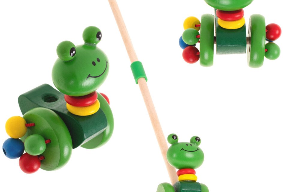 Giocattolo per bambini: una rana di legno su un bastone